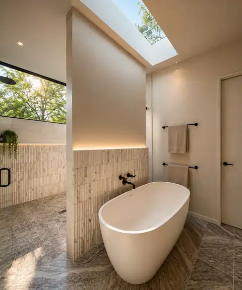 Bathroom with skylight and tiled surround